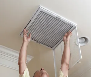 guy repairing air system because air filter dirty