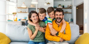 How Long Do Heat Pumps Last- Usage; a family enjoying their comfortable home