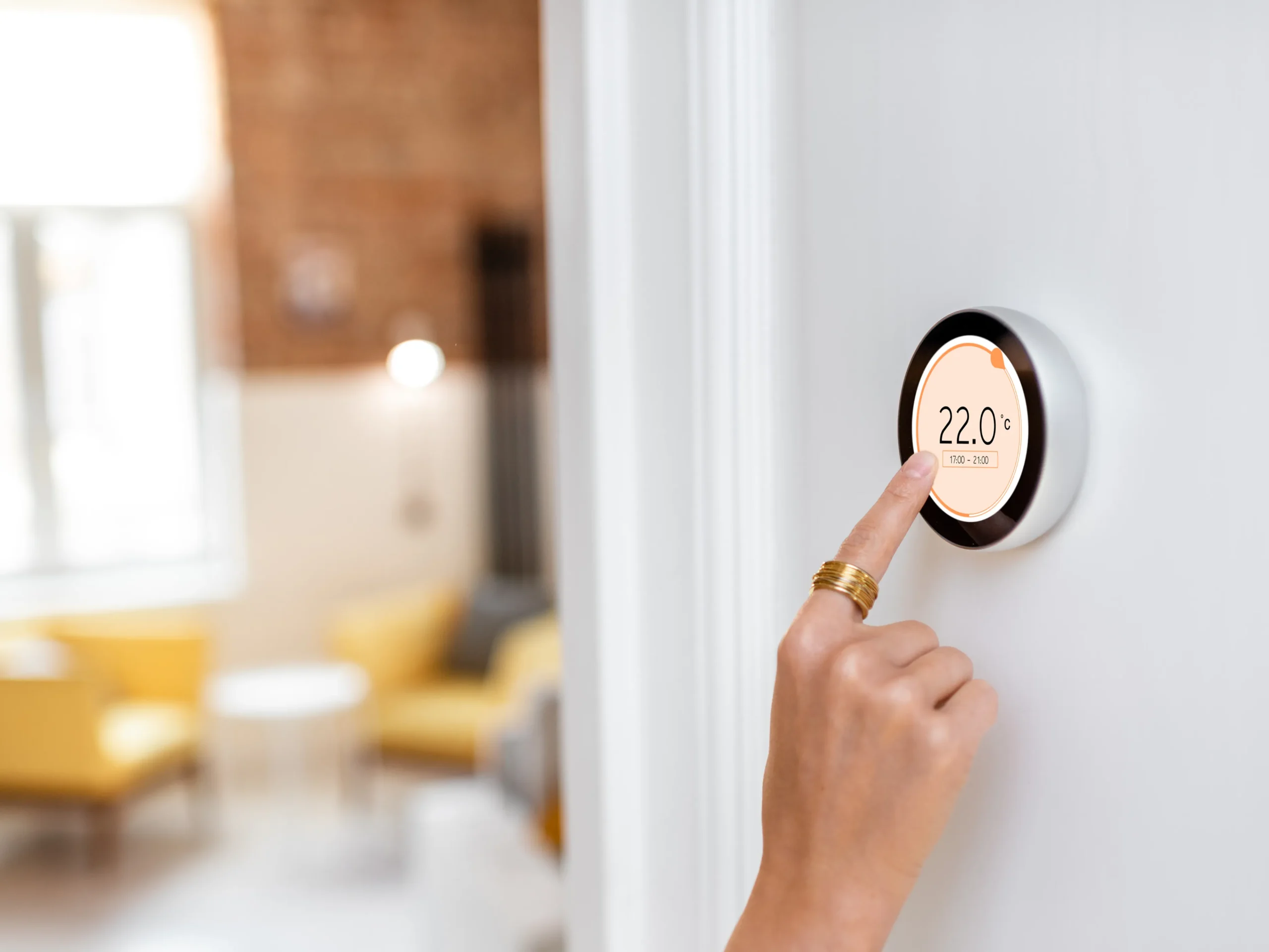 smart thermostat on a wall as a tool to improve your indoor air quality