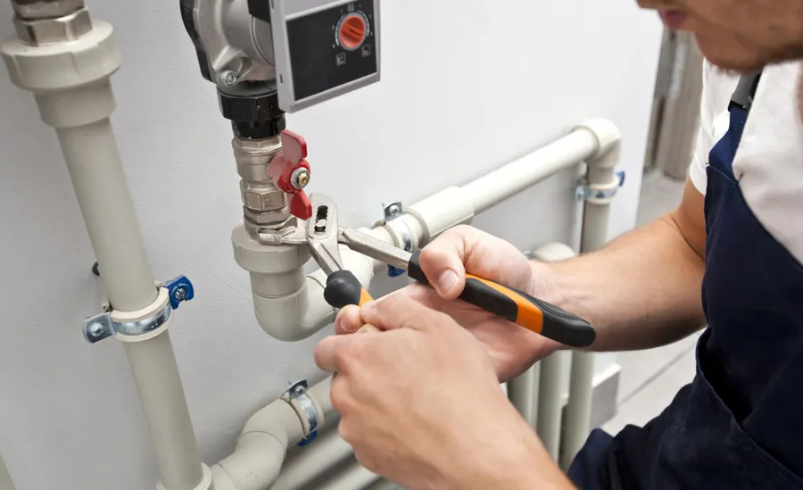 Heating-Services-Near-Me HVAC technician performing heating maintenance
